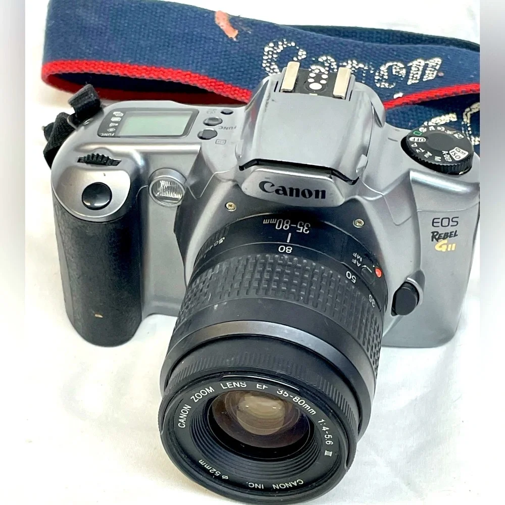Canon EOS Rebel GII 35mm SLR Camera - Silver & Black with shoulder strap